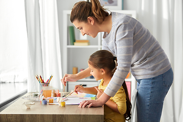 Image showing mother with little daughter drawing at home