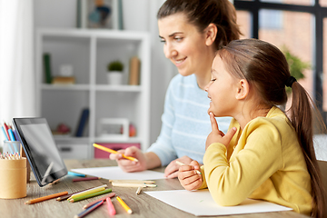 Image showing mother and daughter with tablet pc drawing at home