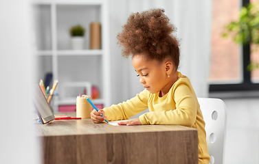 Image showing little girl with felt pen drawing picture at home