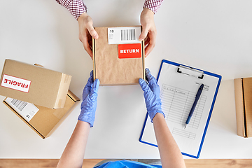 Image showing customer making return of parcel or purchase