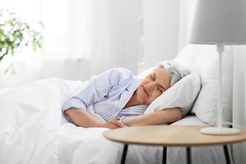 Image showing senior woman sleeping in bed at home bedroom