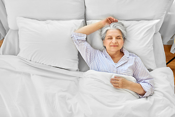 Image showing senior woman sleeping in bed at home bedroom