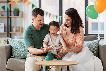 Image showing happy family with little son at birthday party