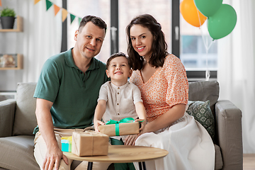 Image showing parents giving birthday present to little son