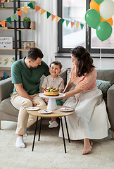 Image showing happy family with birthday cake at home