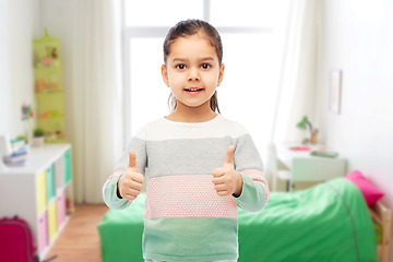 Image showing happy smiling girl showing thumbs up