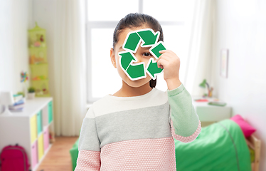 Image showing smiling girl holding green recycling sign
