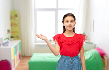 Image showing happy smiling girl holding something on her hand