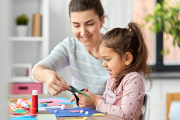 Image showing daughter with mother making applique at home