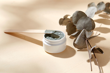 Image showing cosmetic clay mask in jar with wooden spatula