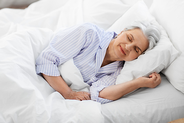 Image showing senior woman sleeping in bed at home bedroom