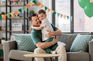 Image showing happy father and little son at home birthday party