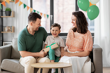 Image showing parents giving birthday present to little son