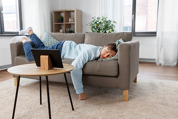 Image showing young man sleeping on sofa at home