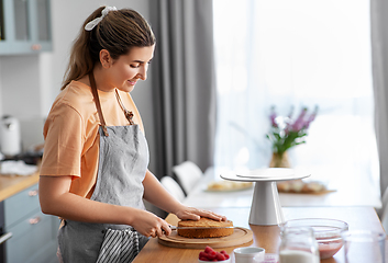 Image showing woman cooking food and baking on kitchen at home