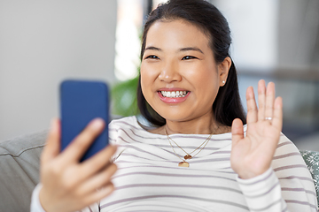 Image showing asian woman with smartphone having video call