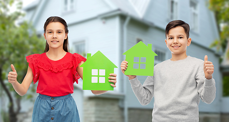 Image showing children with green house icons showing thumbs up