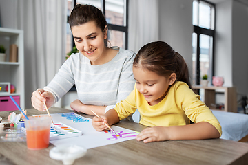 Image showing mother with little daughter drawing at home