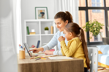 Image showing mother and daughter with tablet pc drawing at home