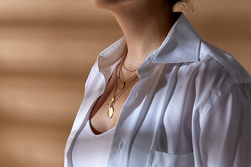 Image showing close up of woman with multi layer gold chains