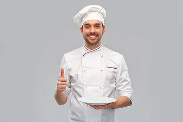 Image showing happy male chef with empty plate showing thumbs up