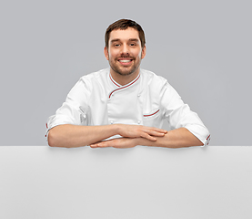 Image showing happy smiling male chef with big white board