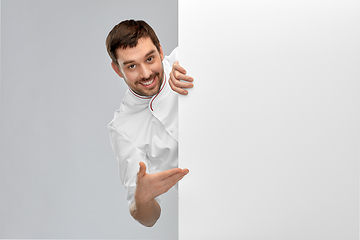 Image showing happy smiling male chef with big white board