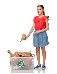 Image showing smiling girl sorting paper waste