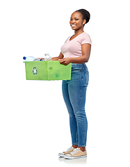 Image showing smiling young asian woman sorting plastic waste