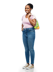 Image showing african woman with food in reusable string bag