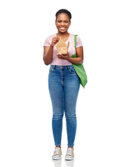 Image showing happy woman with reusable bag for food and wok