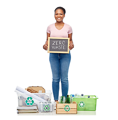 Image showing happy woman sorting paper, metal and plastic waste