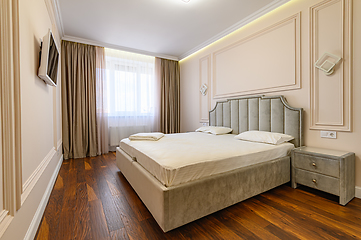 Image showing Beige and brown modern bedroom interior with double bed