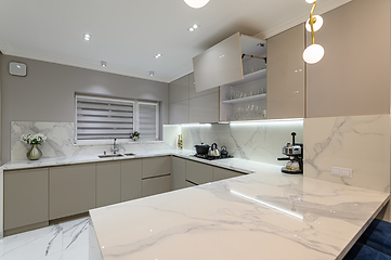 Image showing Luxury white modern marble kitchen in studio space