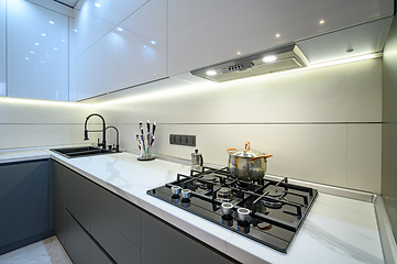 Image showing Closeup to luxury gray modern kitchen interior