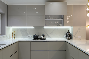 Image showing Luxury white modern marble kitchen in studio space