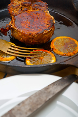 Image showing pork chop seared on iron skillet