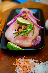 Image showing fresh organic chicken breast with herbs and spices