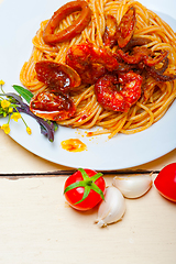 Image showing Italian seafood spaghetti pasta on red tomato sauce