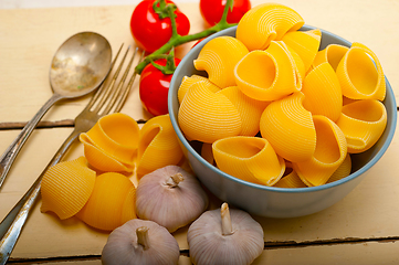 Image showing Italian snail lumaconi pasta with tomatoes