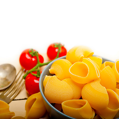 Image showing Italian snail lumaconi pasta with tomatoes