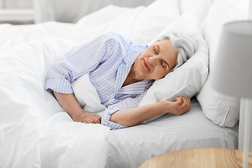 Image showing senior woman sleeping in bed at home bedroom