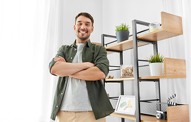 Image showing happy smiling man with crossed arms at home