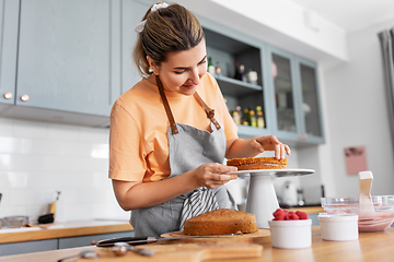 Image showing woman cooking food and baking on kitchen at home