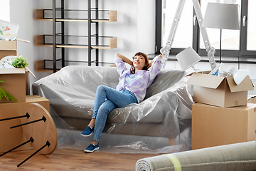 Image showing happy asian woman with stuff moving to new home