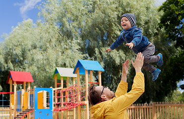 Image showing father with son playing and having fun outdoors