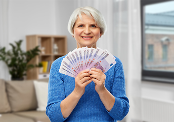 Image showing senior woman with hundreds of euro money banknotes