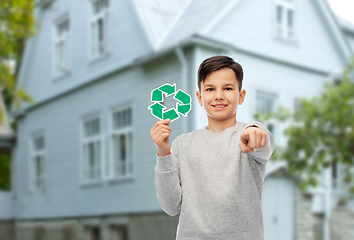 Image showing happy boy with recycling sign pointing to you