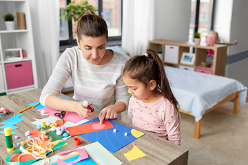 Image showing daughter with mother making applique at home