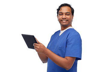 Image showing smiling doctor or male nurse using tablet computer